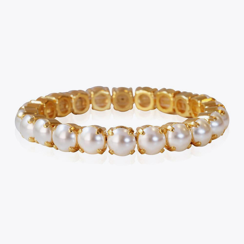 Caroline Svedbom Gia Stud Armband Guld och vit  100163116801, handla denna klocka online eller i butik hos klockmaster